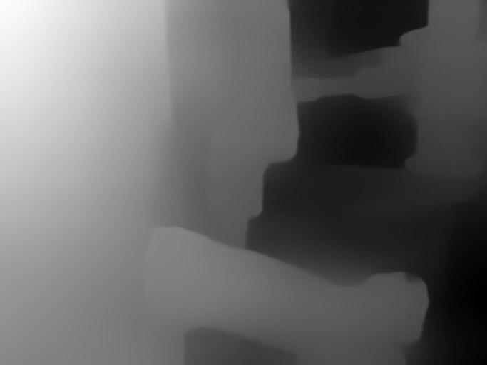 A depth map: soft grey masses without edges or texture, near surfaces pale and far ones dark. Nothing in it identifies an object.